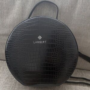 Lambert Olivia model Black Croc-Embossed Round Backpack